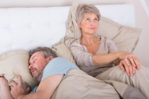 Woman up late because her husband snores