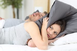 wife annoyed by husband's snoring 