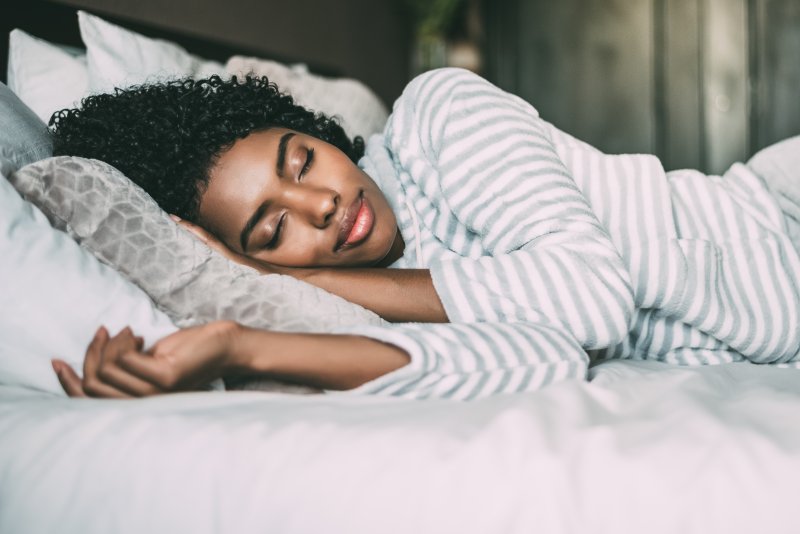 woman curly hair sleeping peacefully